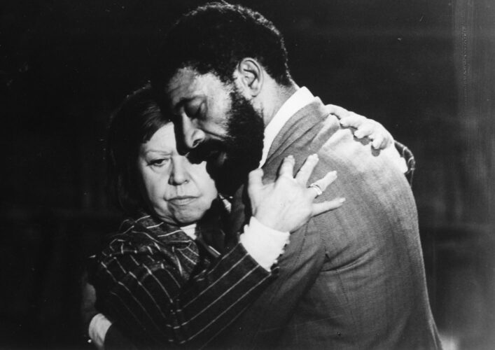 A man and a woman embracing.