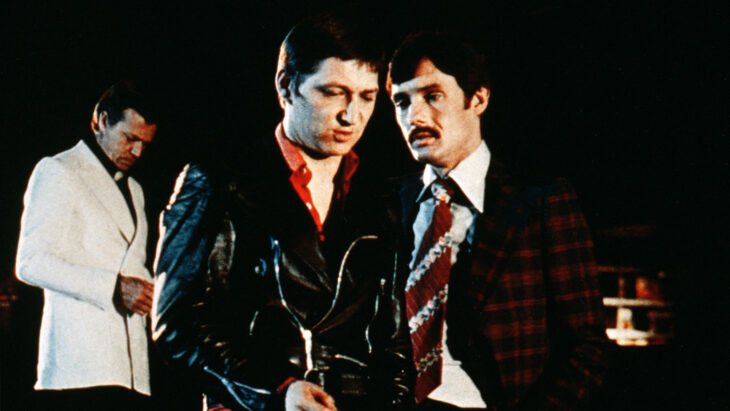 Several men in expensive clothes.